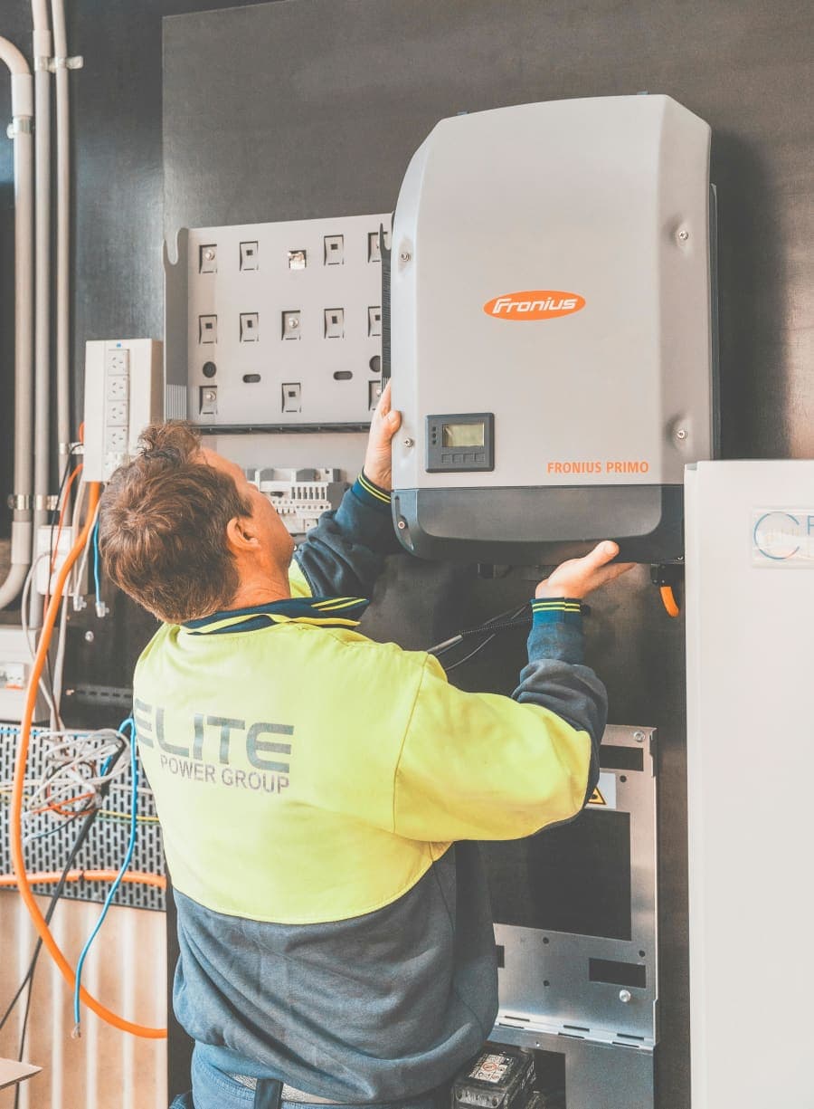 Electrician working on residential electrical service equipment